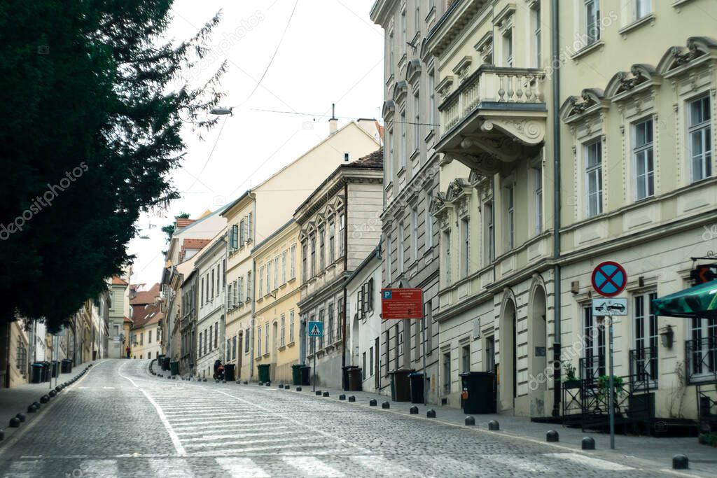 Empty asphalt road and old historic street in downtown of Zagreb, Croatia. Translation from Croatian - parking Tuskanac bypass