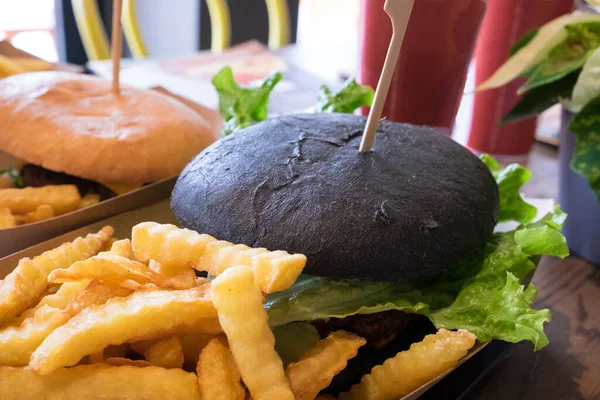 Traditional pub meal - fish burger with french fries