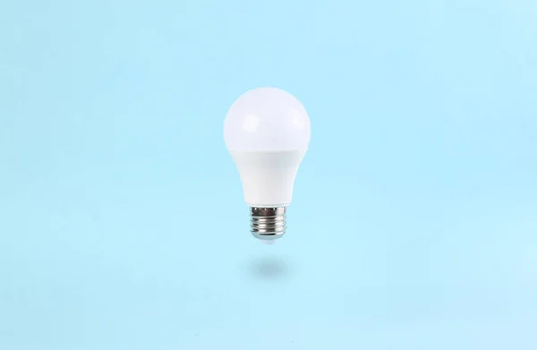 Floating Light Bulb Blue Background Minimal Idea Concept — 图库照片
