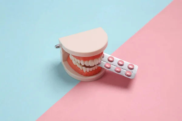 Model Human Jaw Blister Pills Pink Blue Pastel Background Creative — Stock Photo, Image