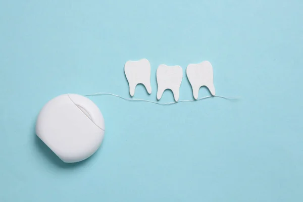 Dental Care Concept Dental Floss Teeth Blue Background Top View — Stock Photo, Image