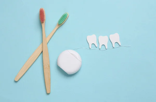 Dental Care Concept Eco Toothbrushes Dental Floss Teeth Blue Background — Stock Photo, Image