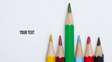Set of colored pencils on a white background close-up. Copy space