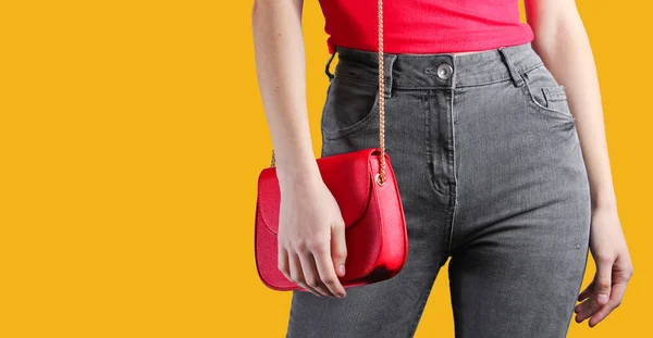 Slim Woman Jeans Shirt Holding Red Bag Yellow Background Minimalism — Stock Photo, Image