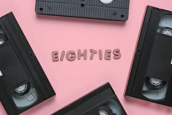 Retro Style Concept 80S Video Cassettes Pink Pastel Background Word — Stock Photo, Image
