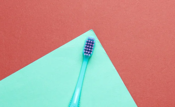 New Toothbrush Colored Paper Background Minimalism Hygiene Concept — Stock Photo, Image