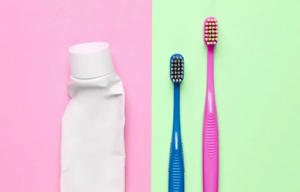 Two Toothbrushes Tube Used Toothpaste Pastel Background Top View — Stock Photo, Image