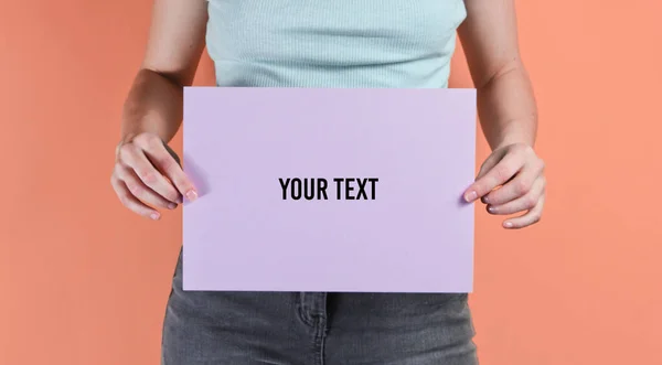 Woman Holding Purple Empty Sheet Paper Copy Space Pink Background — Fotografia de Stock