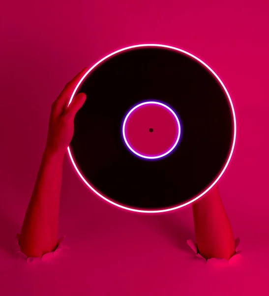 Female Hands Holding Vinyl Record Neon Glow Circle Torn Holes — 스톡 사진
