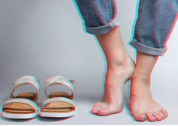 Female Bare Feet Jeans Sandals White Background Studio Fashion Shot — Stockfoto