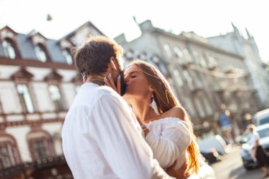 Young couple in love is kissing in the city. Love and romantic concept