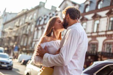 Young couple in love is kissing in the city. Love and romantic concept