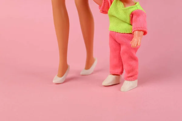 Mom Doll Her Little Daughter Pink Background Concept Motherhood Childhood — стоковое фото