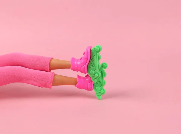 Legs Girl Doll Roller Skates Sitting Pink Background — Foto de Stock