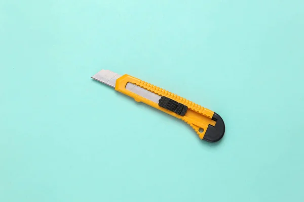 Paper Knife Blue Background Top View — Stock Photo, Image