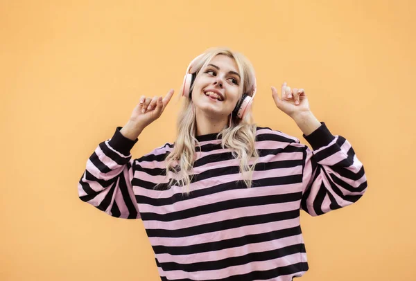 Charismatic Smiling Girl Beret Sweater Listen Musc Headphones Yellow Background — 스톡 사진