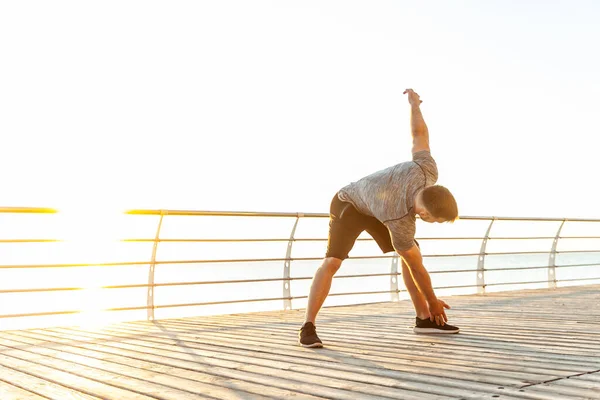 Young Athletic Man Practicing Warm Exercising Beach Early Morning Healthy — Stock Fotó