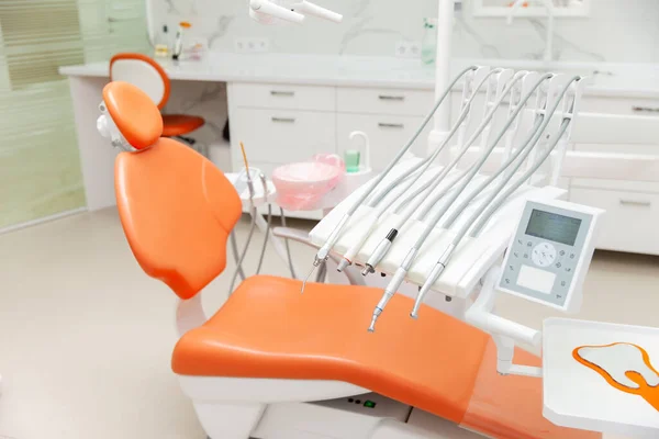 Dentist office with chair and dental drill machine