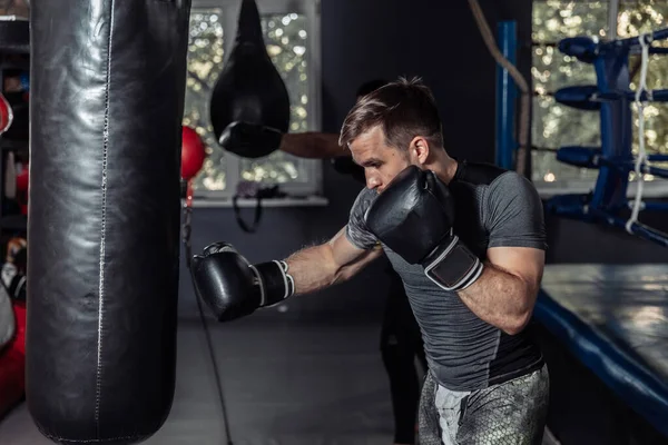 Athlete Boxer Trains Punches Boxing Gloves Punching Bag — Foto de Stock