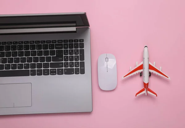 Travel Concept Passenger Plane Laptop Mouse Pink Background Top View — Foto de Stock