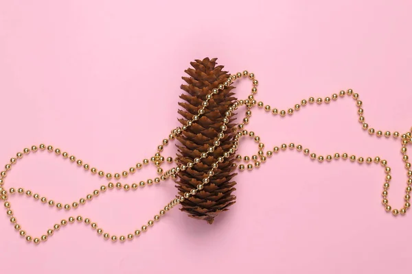 Pine Cone Wrapped Garland Pink Background — Photo