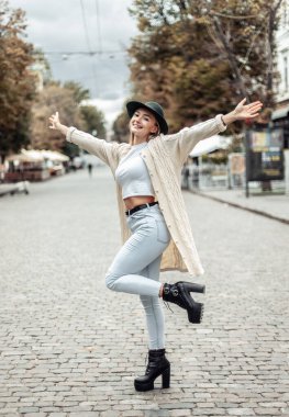 Cute emotional fashion woman having fun in the city. Lifestyle