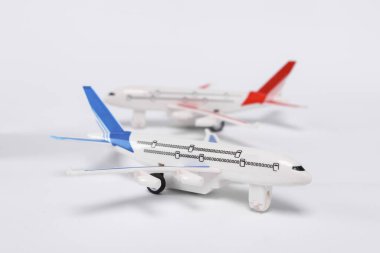 Small passenger air plane models isolated on white background