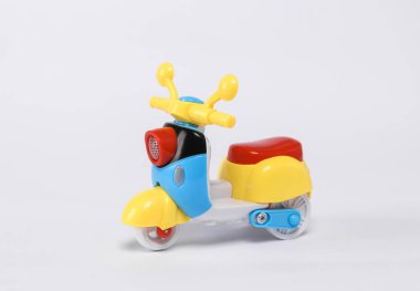 Small retro moped model isolated on white background.