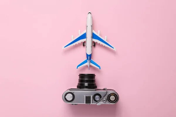 Travel Concept Toy Model Passenger Plane Camera Pink Pastel Background — Stock Photo, Image