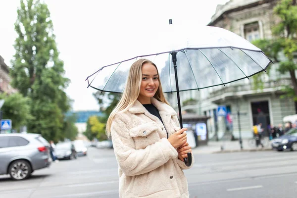 Smiling Fashion Blonde Woman Transparent Umbrella City Lifestyle Rainy Weather — Fotografia de Stock