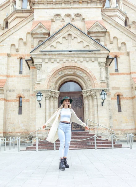 Young fashion woman spends time in the city. Lifestyle