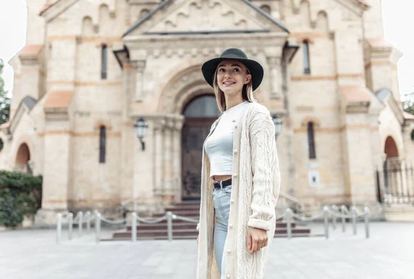 Young fashion woman spends time in the city. Lifestyle