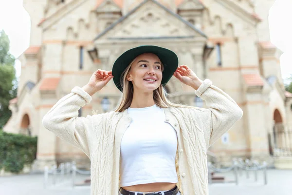 Young fashion woman spends time in the city. Lifestyle