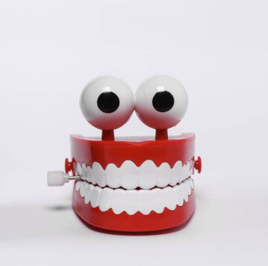 Funny, joke clockwork jaw isolated on white background