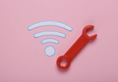 Kablosuz bağlantı onarım konsepti. Pembe arkaplanda kablosuz ağ simgesi var. Üst görünüm