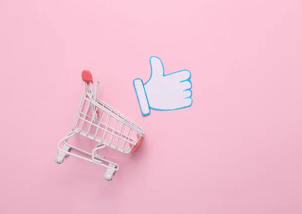 Shopping Trolley Met Papier Gesneden Duimen Omhoog Melding Pictogram Roze — Stockfoto