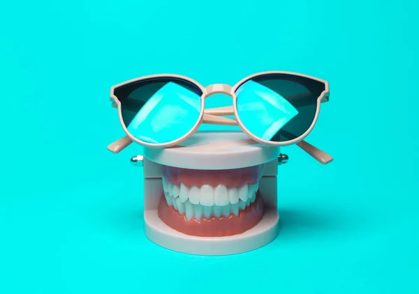 Model Human Jaw Sunglasses Bright Turquoise Background Minmal Still Life — Stock Photo, Image
