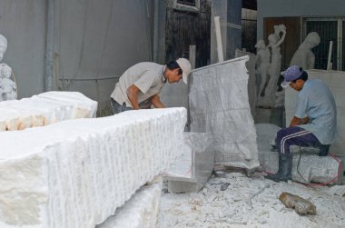 Vietnam, Danang, Vitnam - May 28, 2008: Workers in a marble cutting workshop near the Mrable mountain