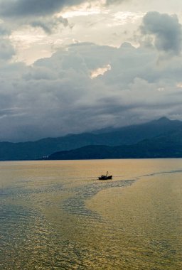 Vietnam, the  Danang coastlline seen from the bay at sunset