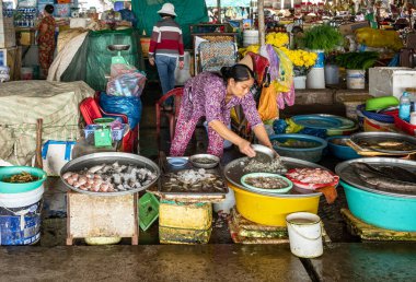 Cai Rang, Vietnam - November 25, 2019: A colorful food market on the Mecong river bank