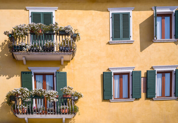 Italy, Bardolino, detail of balconies full of flowers in the old town