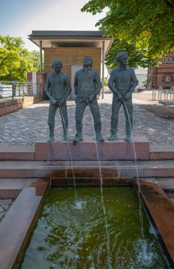 Miltenberg, Germany - July 18, 2021: A sculptural group of boys peeing (Pisslers Fountain), in the old town
