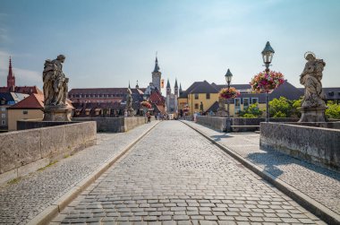 Wurzburg, Germany - July 20, 2021: The Old Main bridge with the statues of Saints with the old town in the background