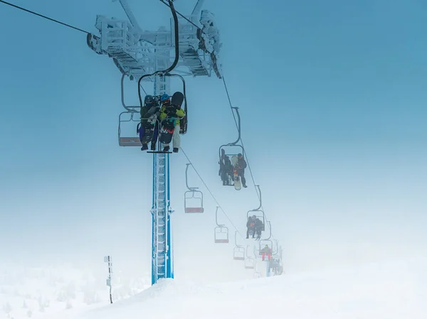 Athletes Climb Chair Lift Skiing Snowboarding — Stock Photo, Image