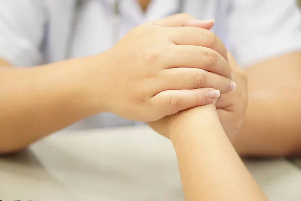 Medical:  Hand touch to encourage patients in the clinic, close-up, motivation technique, Thank you.