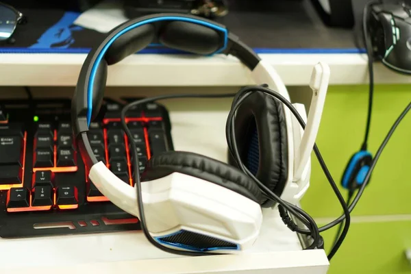 E-sports equipment: Gaming headphones and keyboards, close-up.