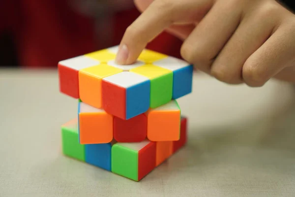 Sport Game: The picture shows a 3x3 magnetic rubik\'s cube, close up.