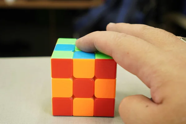 Sport Game: The picture shows a 3x3 magnetic rubik\'s cube, close up.