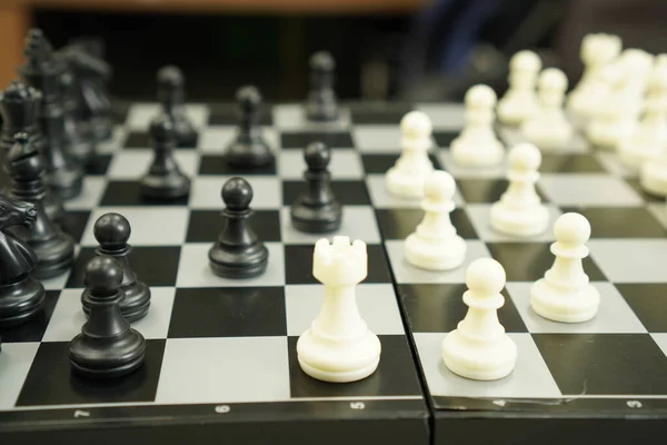 Sport Game : The image shows the beginning of a chess game of a chess player, close up.