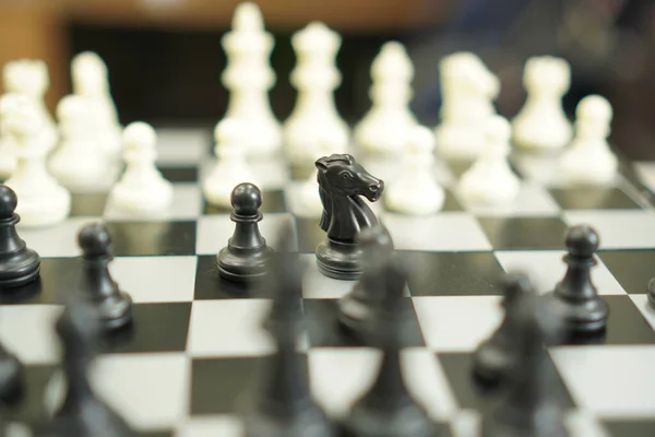 Sport Game : The image shows the beginning of a chess game of a chess player, close up.